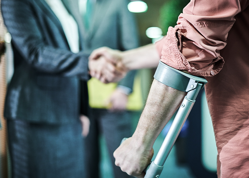 injured_man_shakes_hand_with_employability_expert